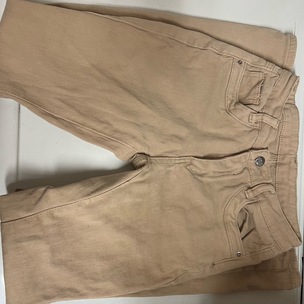 Flared low waisted tan jeans/pants